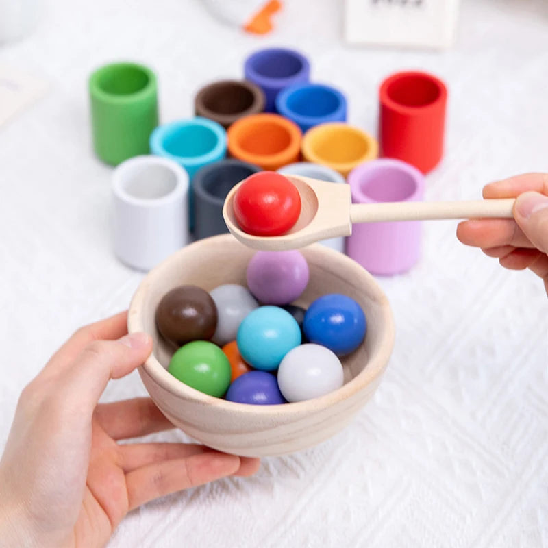 Enhance your child's fine motor skills, cognitive development, and colour recognition with our Montessori Wooden Balls in Cups Sorter. This educational toy includes 12 wooden balls, 12 cups, a bowl, a spoon, and a storage bag. Perfect for ages 3+, it promotes sequencing, problem-solving, and imaginative play. Made from high-quality, non-toxic wood for safe play.