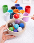 Enhance your child's fine motor skills, cognitive development, and colour recognition with our Montessori Wooden Balls in Cups Sorter. This educational toy includes 12 wooden balls, 12 cups, a bowl, a spoon, and a storage bag. Perfect for ages 3+, it promotes sequencing, problem-solving, and imaginative play. Made from high-quality, non-toxic wood for safe play.