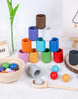 Enhance your child's fine motor skills, cognitive development, and colour recognition with our Montessori Wooden Balls in Cups Sorter. This educational toy includes 12 wooden balls, 12 cups, a bowl, a spoon, and a storage bag. Perfect for ages 3+, it promotes sequencing, problem-solving, and imaginative play. Made from high-quality, non-toxic wood for safe play.