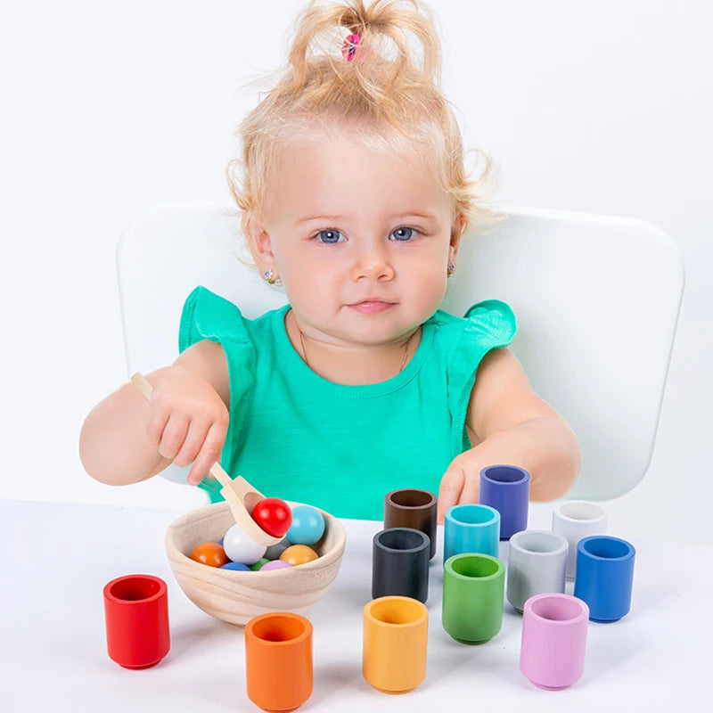 toddler playing with Montessori Wooden Balls in Cups Sorter - Rainbow Colour Sorting Game