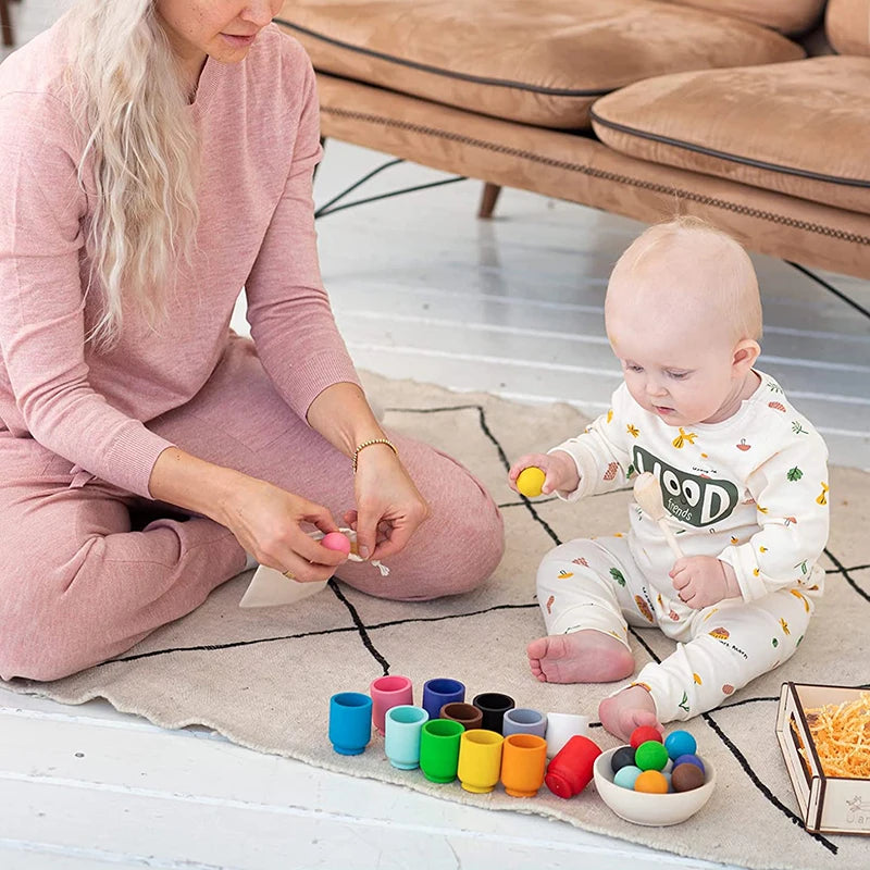 BABY playing with Montessori Wooden Balls in Cups Sorter - Rainbow Colour Sorting Game