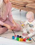 BABY playing with Montessori Wooden Balls in Cups Sorter - Rainbow Colour Sorting Game